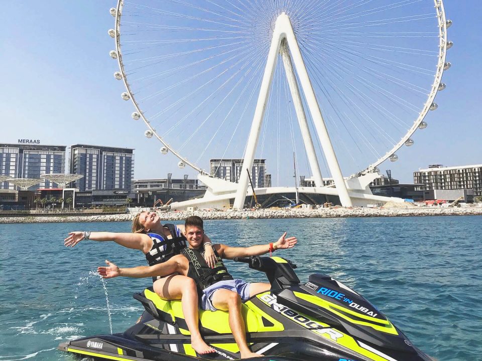 Couple riding a jetski in Dubai